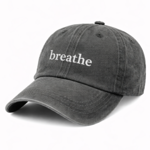 Breathe embroidered on dark cap "breathe"